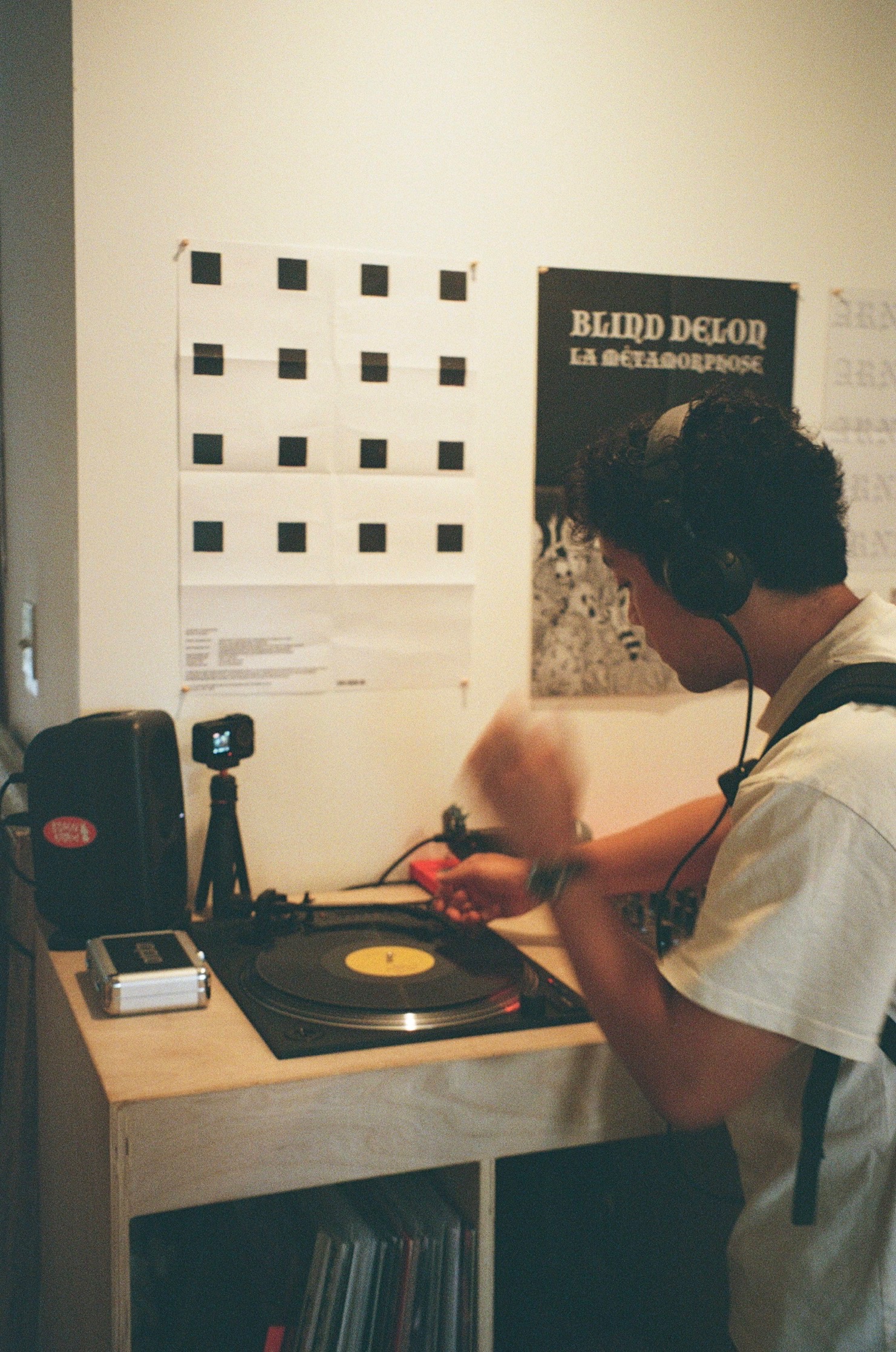 Listening to a record on the turntable with headphones on