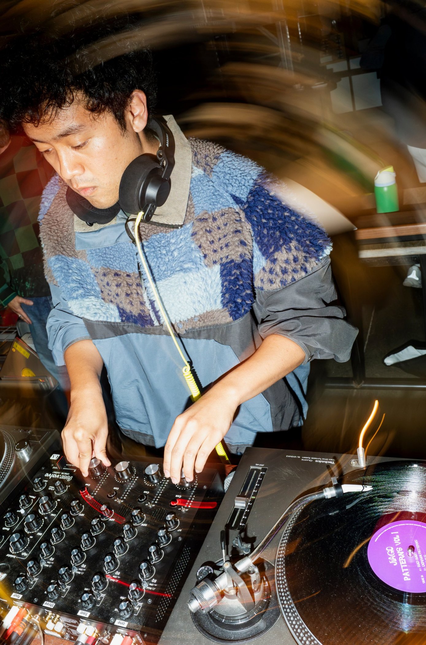 Mixing on the turntables with headphones on